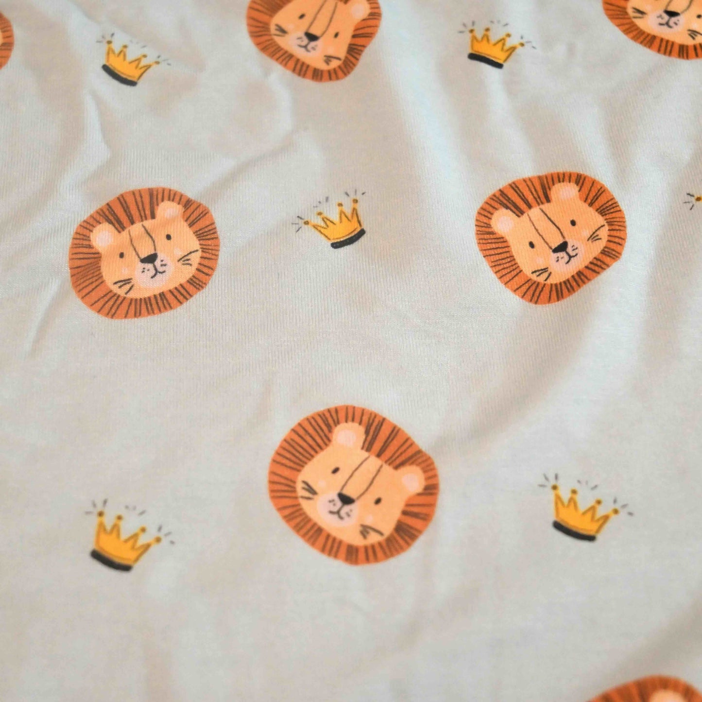 fabric swatch detail shot of the lion and crown pattern
