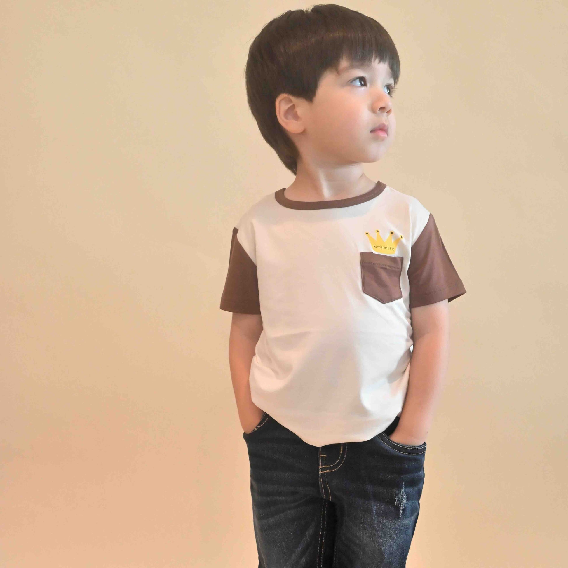 toddler boy with hands in pockets wearing Jesus is King tee