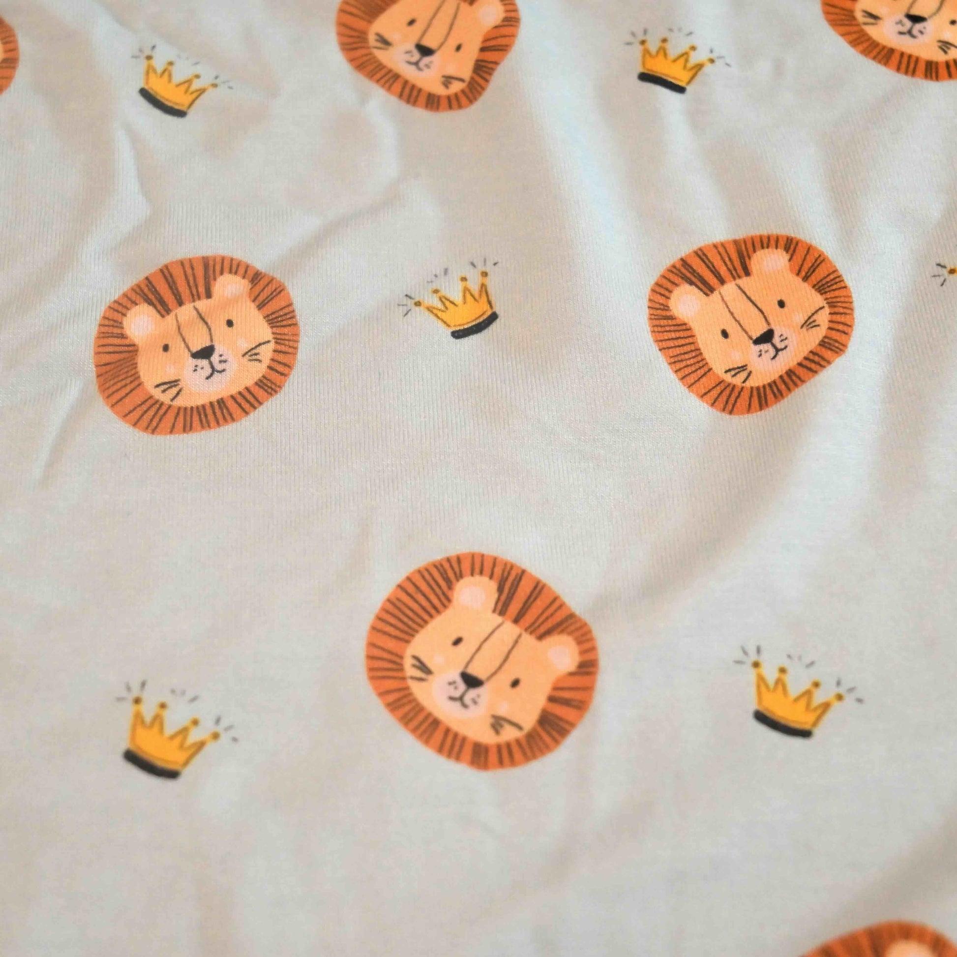 fabric swatch detail shot of the lion and crown pattern