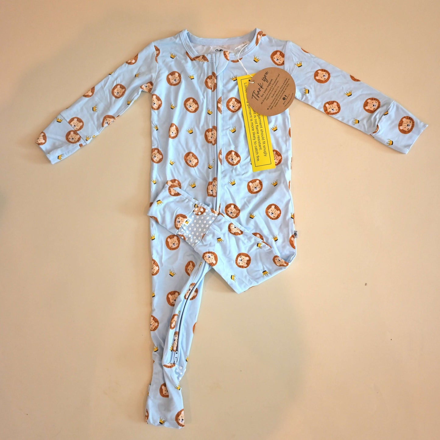 lay flat zip romper with lion pattern
