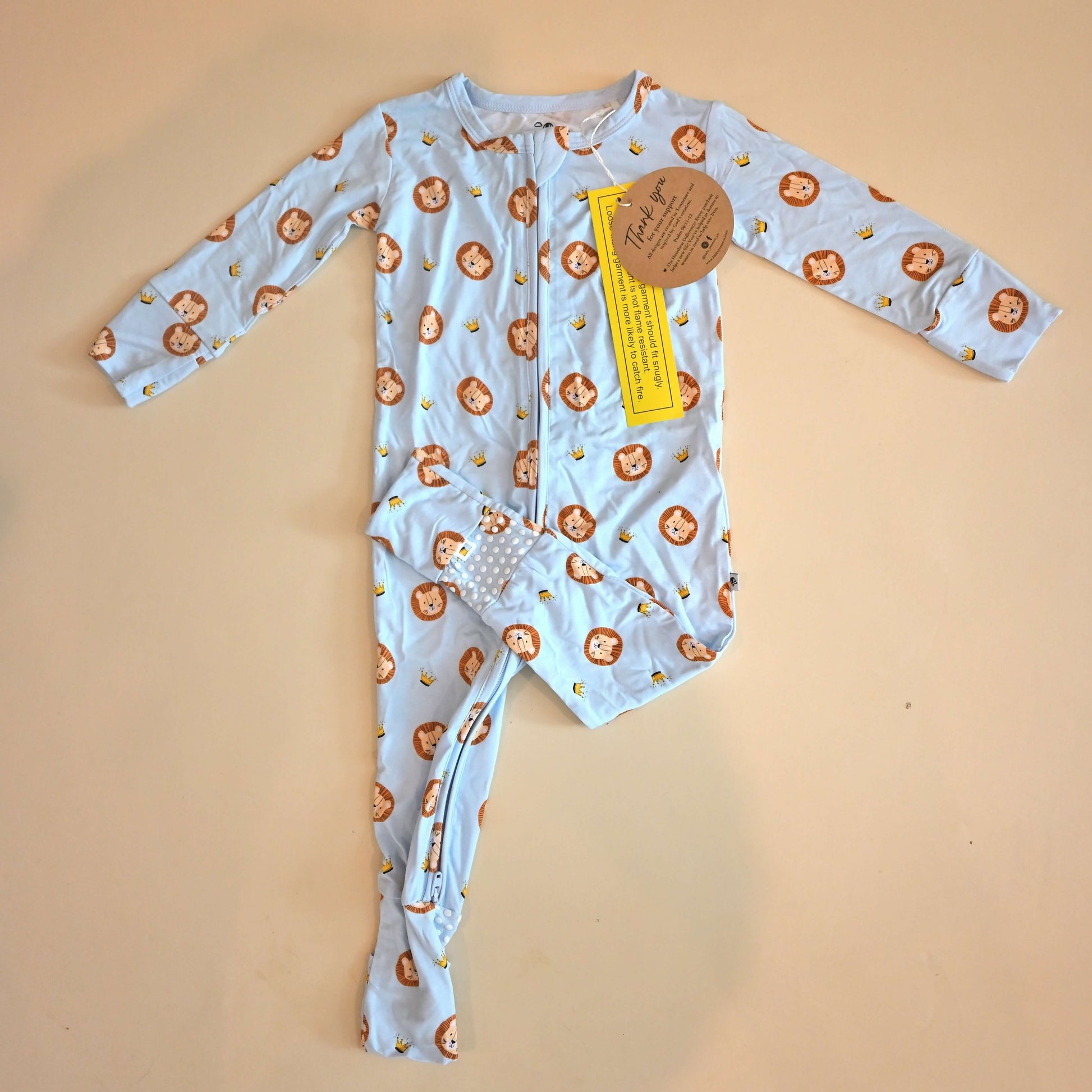lay flat zip romper with lion pattern